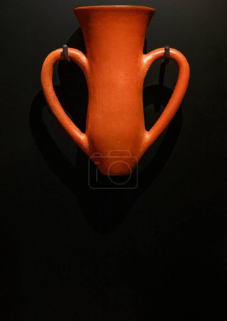 Photo for Canakkale, Turkey - Nov 19, 2023 Depas Amphikypellon; An earthenware  drinking glass from the Bronze Age on dark background. Exposition of ancient art at the Archaeological museum - Royalty Free Image