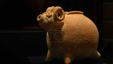 Photo for Canakkale, Turkey - Nov 19, 2023 Anatolian Bronze age ram head shaped drinking rhyton (pottery vessel).Exposition of ancient art at the Archaeological museum - Royalty Free Image