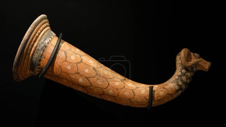 Photo for Canakkale,Turkey, Nov 19, 2023 Anatolian Bronze age ram head shaped drinking horn. Exposition of ancient art at the Archaeological museum - Royalty Free Image