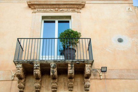 Photo for Decorated balcony of Nicolaci palace in Via Nicolaci, Noto, Sicily, Italy, - Royalty Free Image