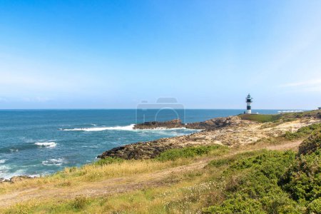 Photo for The lightouse on isla Pancha in Galicia, atlantic coast of Spain - Royalty Free Image