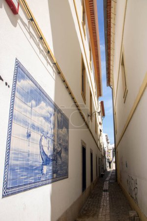 Photo for At Aveiro, Portugal, On 30-08-2023-very narrow street of the historic town decorated with ceramic tiles - Royalty Free Image