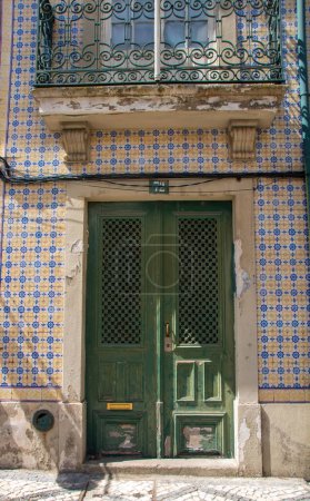 Photo for At Aveiro, Portugal, On 30-08-2023-detail of a door typically decorated with azulejos blue tiles - Royalty Free Image