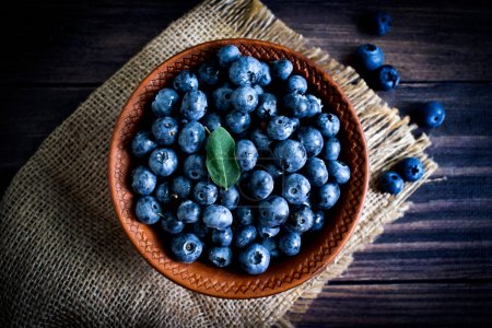 Fresh blueberries on old background