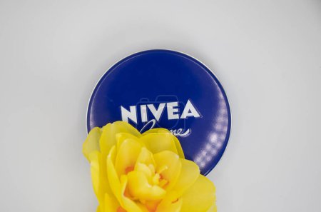 Photo for May 1, 2022 Ukraine city Kyiv jar of Nivea cream, narcissus flower - Royalty Free Image