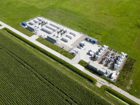 Aerial view of batteries for energy storage supplying and stabilizing a larger amount of renewable energy to the electric grid, Flevopolder, The Netherlands