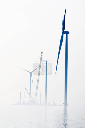 A transport ship and crane for the construction of an offshore windpark, Ijsselmeer The Netherlands