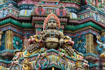 Photo for Colored decorations and statues on the exterior of the Hindu Temple Sri Maha Mariamman Temple ("Wat Phra Si Maha Umathewi") on Si Lom Road in Bangkok, Thailand. Built in1879. - Royalty Free Image