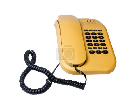 Old analog push-button telephone with telephone receiver and curly cable isolated on white.
