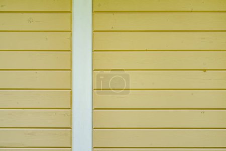 Photo for Soft Yellow Wooden Siding Texture with White Trim - Royalty Free Image