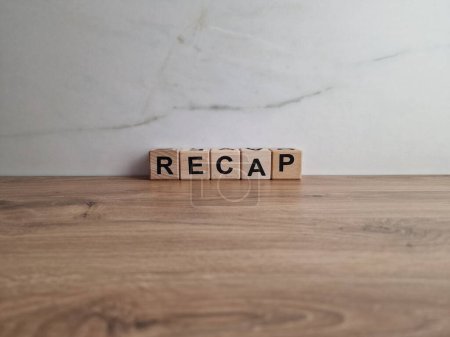Photo for Recap word from wooden blocks on desk - Royalty Free Image