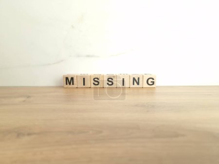 Photo for Word missing made from wooden blocks. Disappearance concept - Royalty Free Image