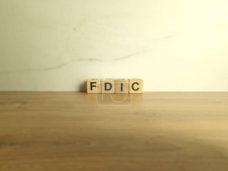 Photo for FDIC abbreviation from wooden blocks. Federal Deposit Insurance Corporation acronym. Finance and economy concept - Royalty Free Image