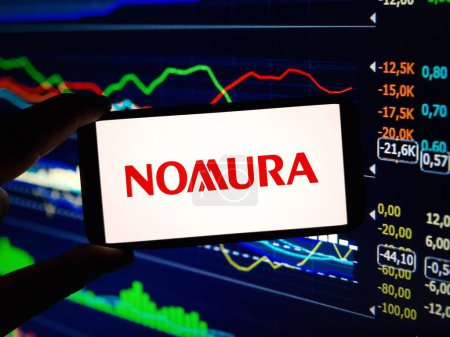 Photo for Konskie, Poland - February 12, 2024: Nomura Holdings company logo displayed on mobile phone - Royalty Free Image