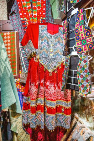 Traditional pakistani female clothes, colorful embroidered dress. 