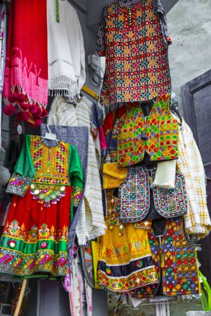 Traditional pakistani female clothes, colorful embroidered dress. 