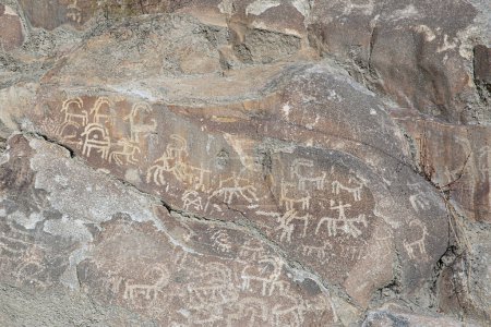 Prehistoric Petroglyphs in Hunza valley, sacred rock of Hunza, rock carvings in Gilgit Baltistan, Pakistan. 