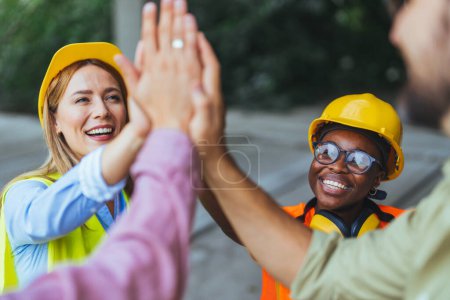 Photo for Group of successful engineers on construction site - Royalty Free Image