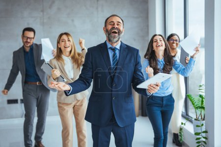 Photo for Successful businesspeople having a meeting in an office. Business concept. Business meeting office conference team teamwork. Business People Celebrating with arm raised up - Royalty Free Image