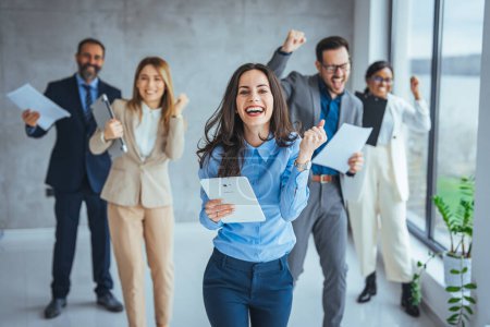 Photo for Excited happy multiracial businesspeople have fun engaged in activity in office together, overjoyed diverse colleagues dance celebrate successful business project, Friday celebration concept - Royalty Free Image