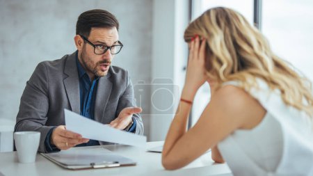 Photo for Furious businessman shout at female employee working in shared office, mad male boss scream at guilty intern, blaming for mistake, CEO accuse woman worker in company failure or bad results - Royalty Free Image