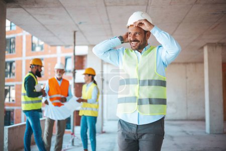Photo for Portrait of man architect at building site. Confident construction manager in formal clothing wearing white hardhat. Successful civil engineer at construction site with copy space. - Royalty Free Image