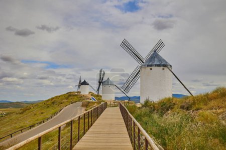 Old windmills in top of the hill in Consuegra Village. Land of the Giants and Don Quixote stories.