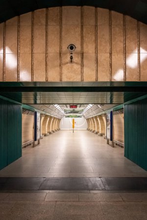Photo for "The Jiho z Podbrady metro station was put into operation at the end of 1980. The station is a stamped, pillared, three-aisled one with a shortened central tunnel to 34 m, seven pairs of passages to the platform - Royalty Free Image