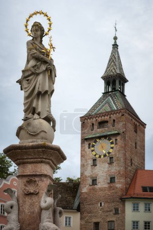 Photo for Landsberg am Lech, famous medieval village over the bavarian romantic road. Detail of the main square tower and Marienbrunnen (fountain of the Virgin Mary) - Royalty Free Image