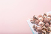 Beautiful shiny pink decorative balls on a pink background. Top view, flat lay Poster #620265034