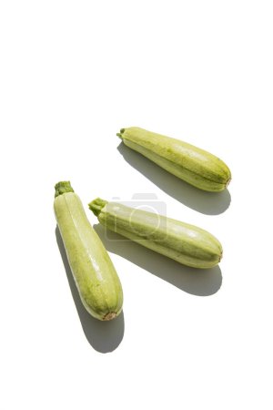 Photo for Fresh zucchini on a white background. Top view, flat lay. - Royalty Free Image