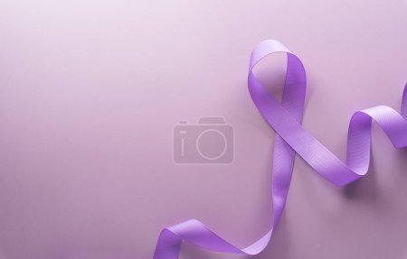 Photo for Purple ribbon on pastel paper background for supporting World Cancer Day campaign on February 4. - Royalty Free Image