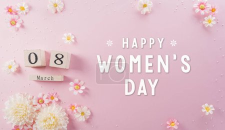 Concepto de decoración Happy Women 's Day hecho de flores y calendario de madera sobre fondo rosa pastel.