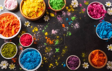 Photo for Happy Holi decoration, the indian festival.Top view of colorful holi powder on dark background. - Royalty Free Image