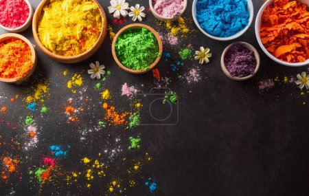 Photo for Happy Holi decoration, the indian festival.Top view of colorful holi powder on dark background. - Royalty Free Image