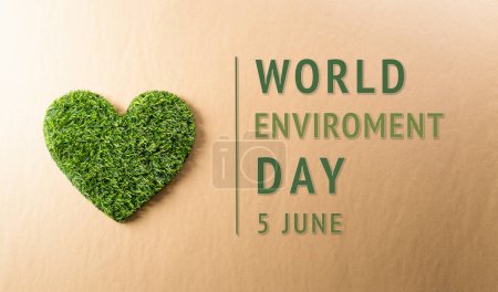 A handmade green heart on dark background. World environment day, earth day, save earth and eco concept.