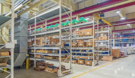 Photo for Shelves with goods boxes in distribution warehouse at industrial factory. - Royalty Free Image