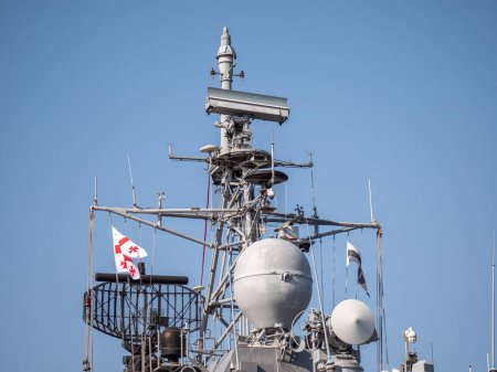 Photo for Detailed view of Georgian Flag on Turkish Navy warship superstructure featuring radar equipment and antennas - Batumi, Georgia - 05 March 2024. - Royalty Free Image