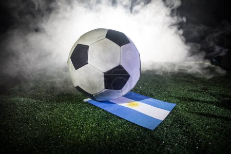 Photo for Soccer 2022. Grand Final Argentina vs France theme. Soccer ball on green grass. Support your country or cheer concept. Selective focus - Royalty Free Image