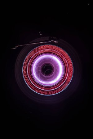 Photo for Music Dj concept. Trail of fire and smoke on vinyl record. Burning vinyl disk. Turntable vinyl record player on dark background. Selective focus - Royalty Free Image