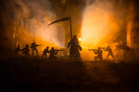 Foto de Concept of death soldiers during the war. Grim reaper (Skeleton) holding schyte with military fighting silhouettes in destroyed city. Selective focus - Imagen libre de derechos