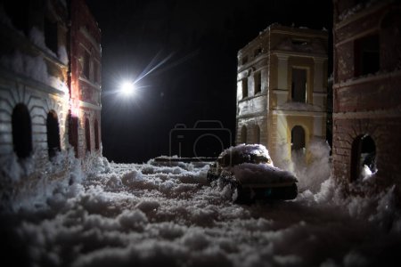 Photo for War apocalypse concept. Snow covered ruined city destroyed by war. Creative artwork decoration in dark. Selective focus - Royalty Free Image