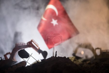 Photo for Turkey Earthquake happend in February 2023. Decorative photo with Turkish flag, and ruined city buildings. Pray for Turkey. Selective focus - Royalty Free Image