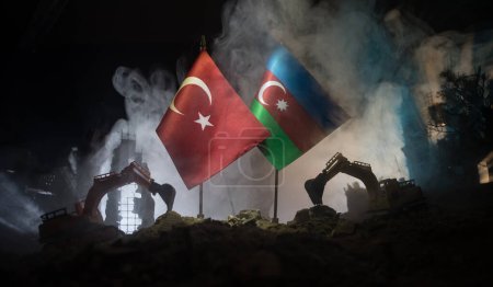 Turkey Earthquake happend in February 2023. Decorative photo with Turkish and Azerbaijan flag (Two brother countries) with ruined city buildings. Pray for Turkey. Selective focus
