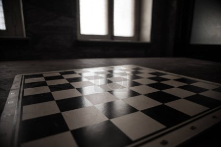 Photo for Chess board game concept of business ideas and competition. Empty chessboard on wooden table. Dark background. Selective focus - Royalty Free Image