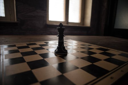 Photo for Chess board game concept of business ideas, competition and strategy. Chess figures on a dark background with smoke and fog. Selective focus - Royalty Free Image
