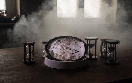 Téléchargez les photos : Time concept. Many clocks on old wooden table with copy space studio shot - en image libre de droit