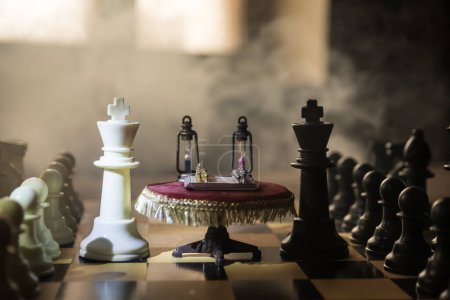 Photo for Chessboard with table miniature on chessboard. Chess board game concept of business ideas, competition and strategy. Chess playing chess concept. Selective focus - Royalty Free Image