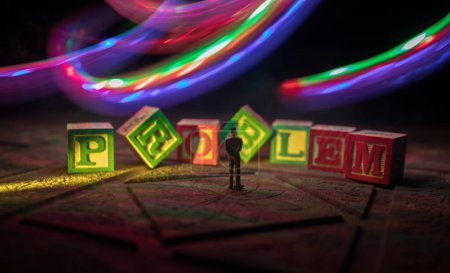 Photo for Businessman standing at the large wooden letters making a word PROBLEM . Business and success. Weight of problems. Resolve all problems concept. Toy decoration, selective focus - Royalty Free Image
