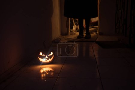 Photo for Halloween horror concept with glowing pumpkin. Halloween evil pumkins smilin faces in dark . Selective focus. Long exposure shot - Royalty Free Image